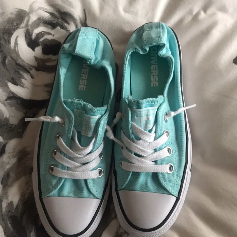 aqua blue slip on converse